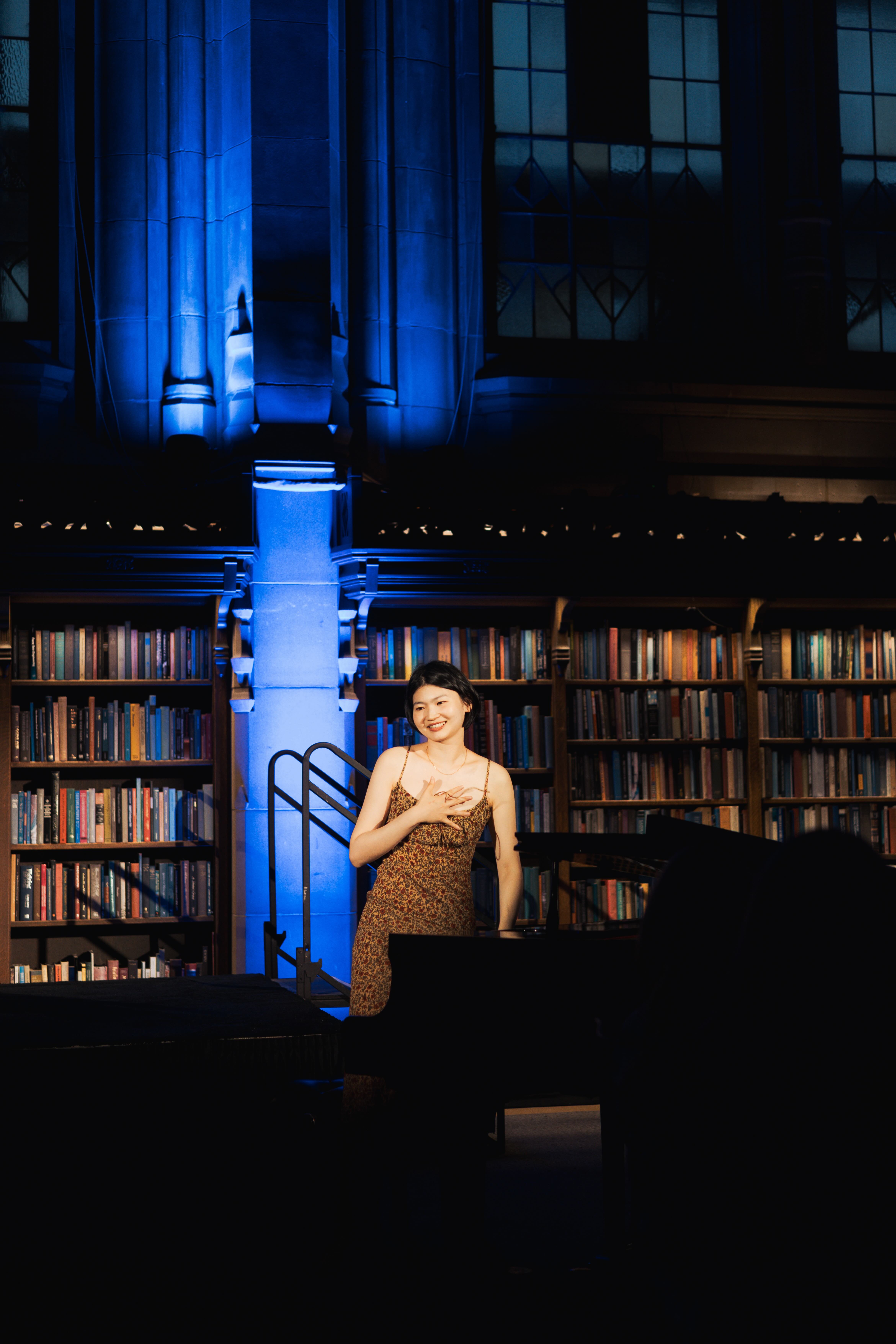 Cicy Li playing piano at an event