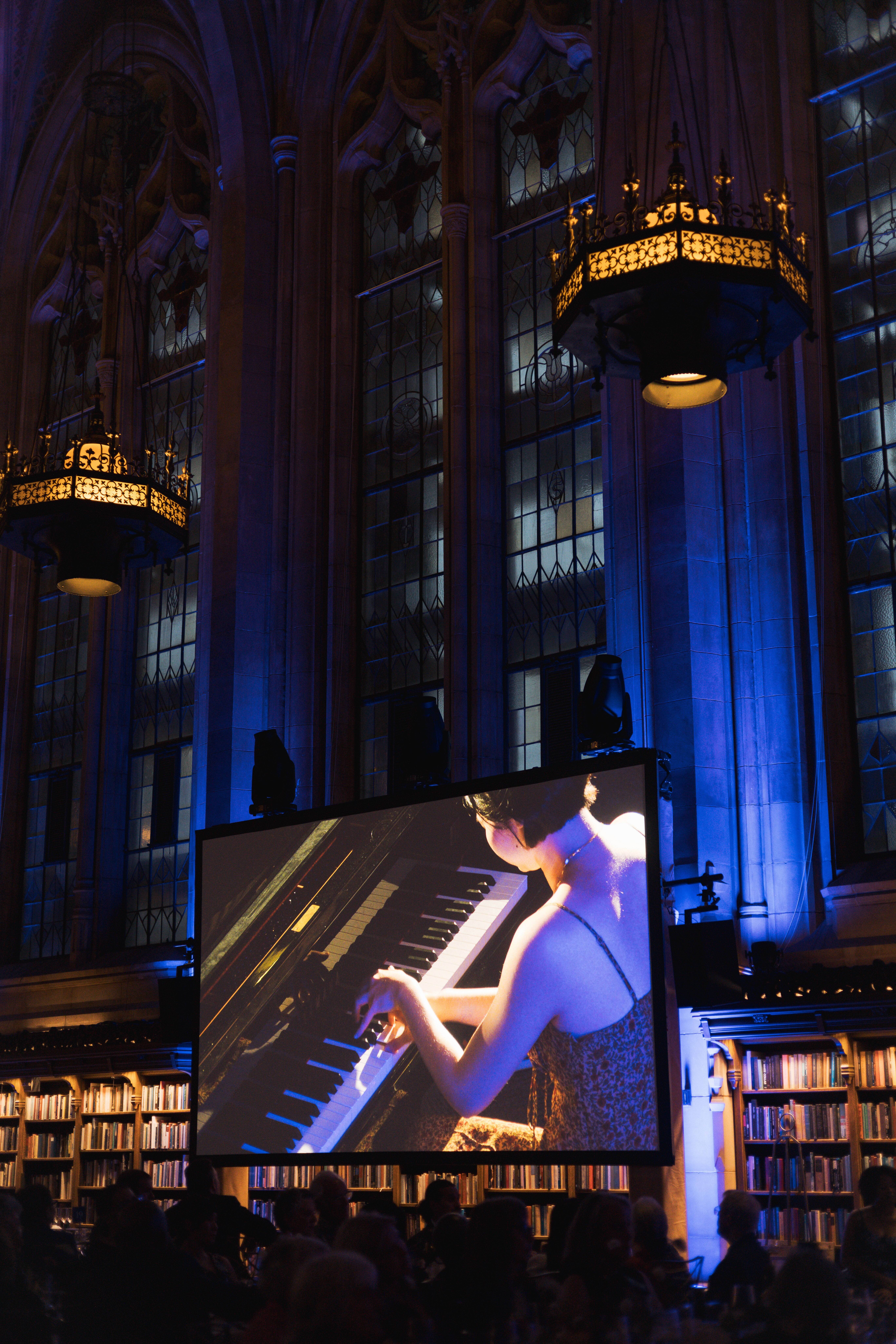 Cicy Li looking down at piano