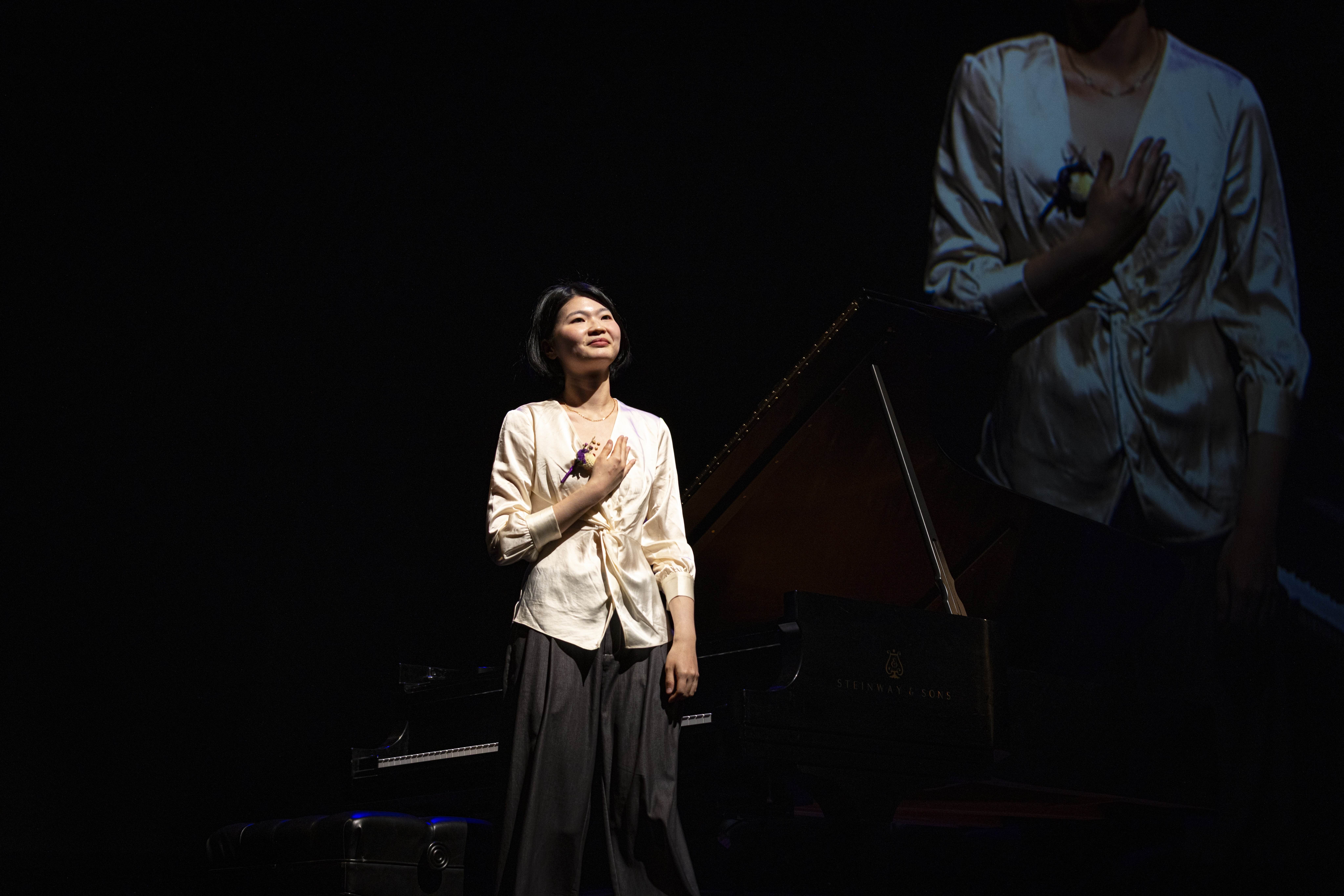 Cicy Li accompanying a violinist